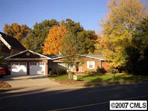 4101 Sharon View Road Charlotte, NC 28226 - Photo 1 of 8 a front view of a house with a yard