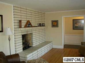 4101 Sharon View Road Charlotte, NC 28226 - Photo 4 of 8 a living room with furniture and a fireplace