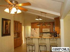4101 Sharon View Road Charlotte, NC 28226 - Photo 5 of 8 a bathroom with a glass shower door and a sink