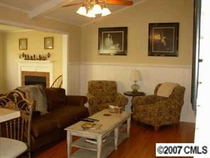 4101 Sharon View Road Charlotte, NC 28226 - Photo 6 of 8 a living room with furniture and a fireplace