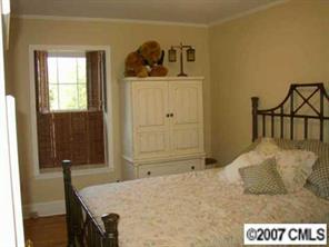 4101 Sharon View Road Charlotte, NC 28226 - Photo 8 of 8 a bedroom with a bed and cabinet