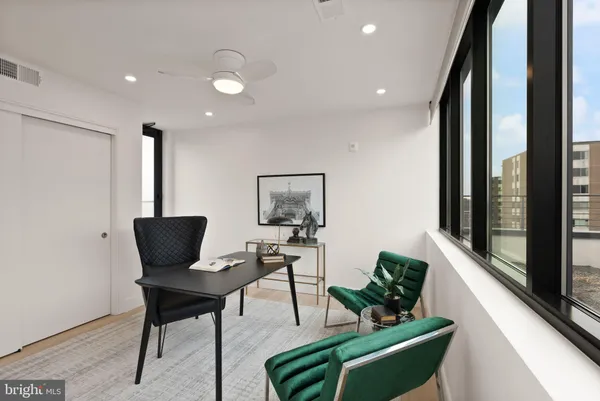 a view of a hallway with seating area