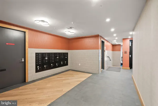 a view of an entryway with wooden floor
