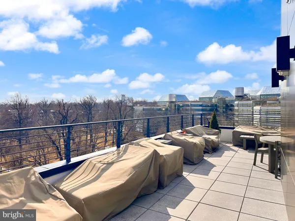 a view of a terrace with furniture