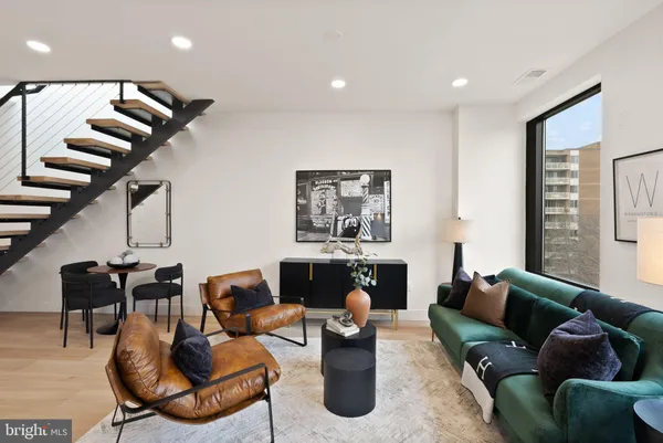a view of entryway with livingroom and wooden floor