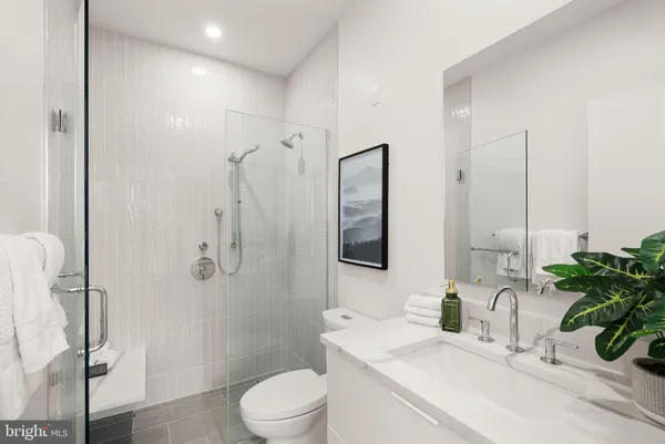 a bedroom with a bed and a lamp