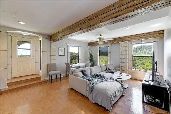 a living room with furniture and a large window