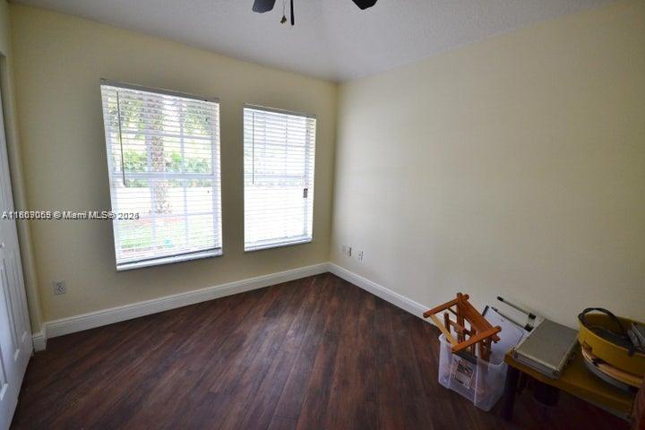 17569 North 89th Place North Loxahatchee, FL 33470 - Photo 17 of 24 a room with gym equipment and a window