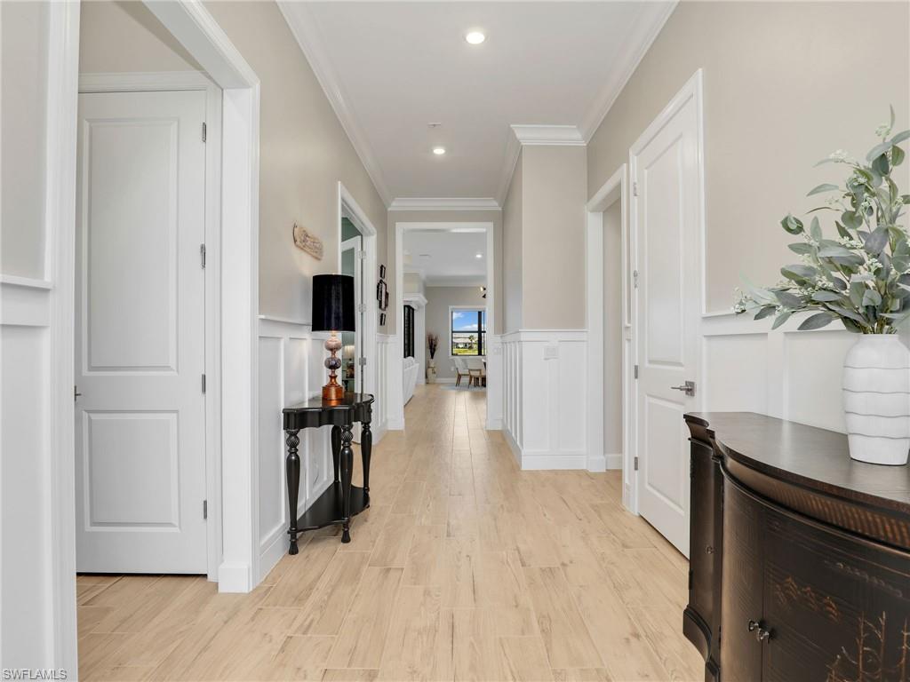18412 Ridgeline Drive Estero, FL 33928 - Photo 6 of 50 a view of a hallway view with living room and wooden floor