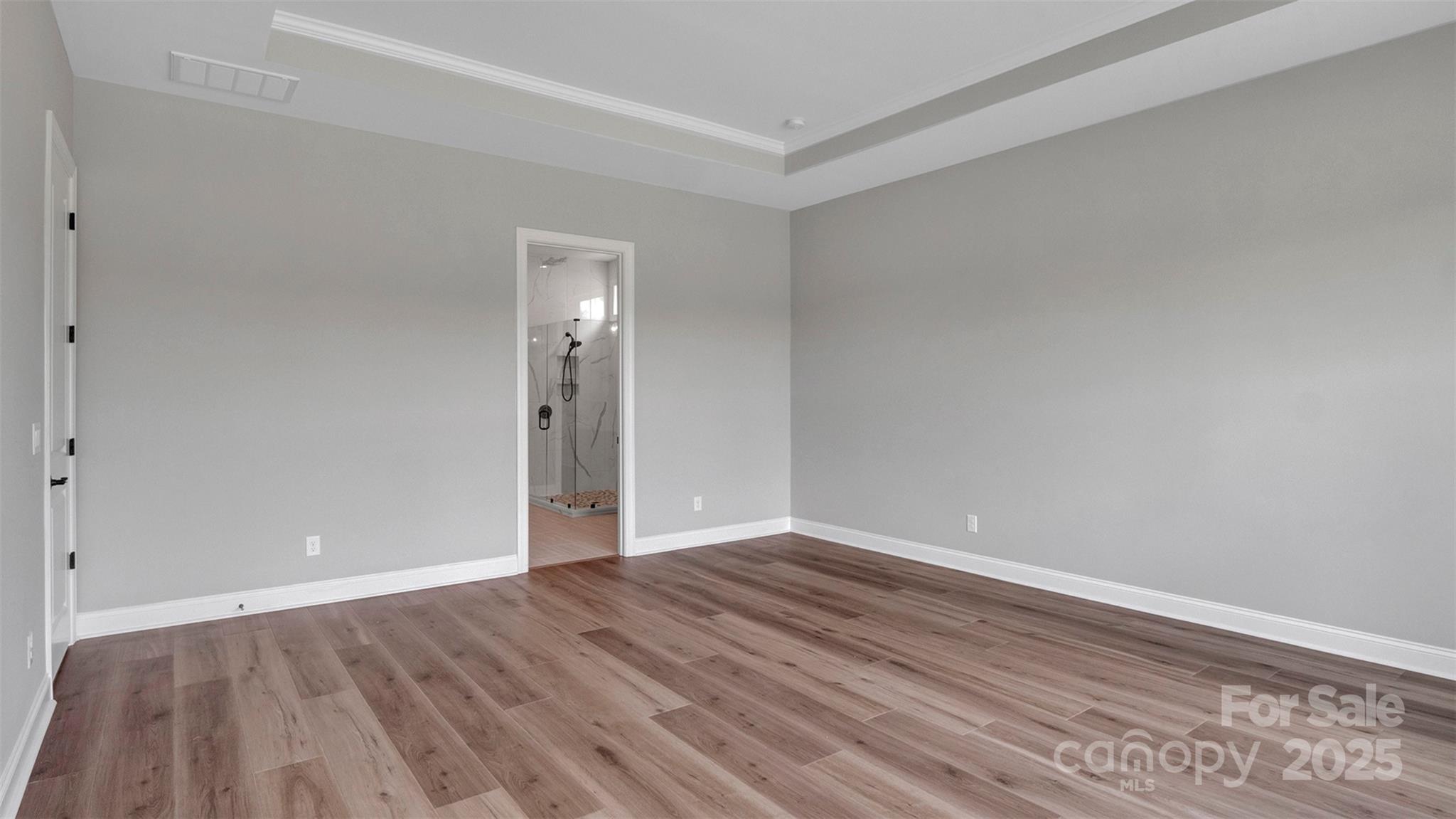 1031 Rabbit Hl Lane Monroe, NC 28110 - Photo 13 of 47 a view of an empty room with wooden floor