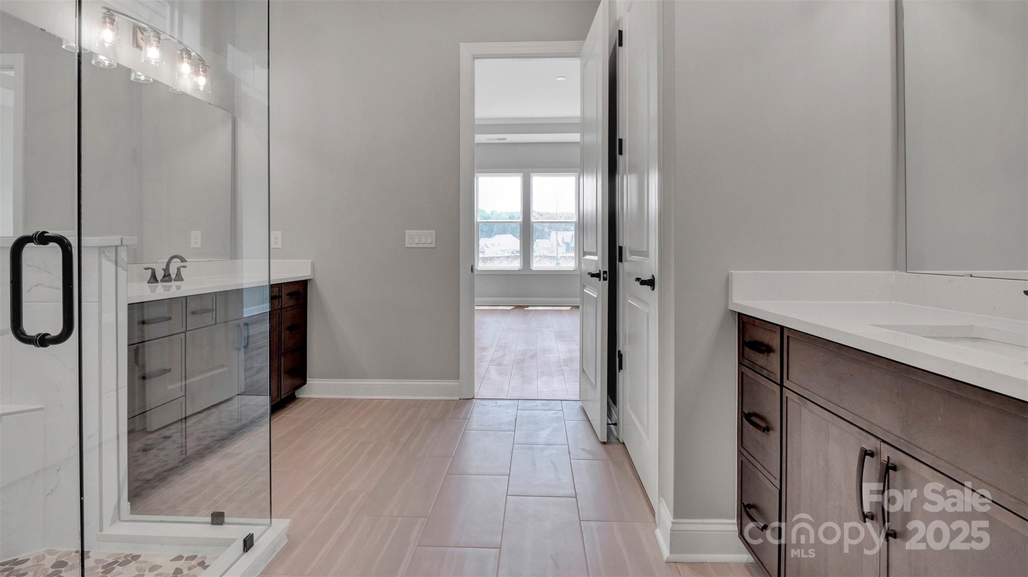 1031 Rabbit Hl Lane Monroe, NC 28110 - Photo 15 of 47 a bathroom with a granite countertop sink a mirror and shower