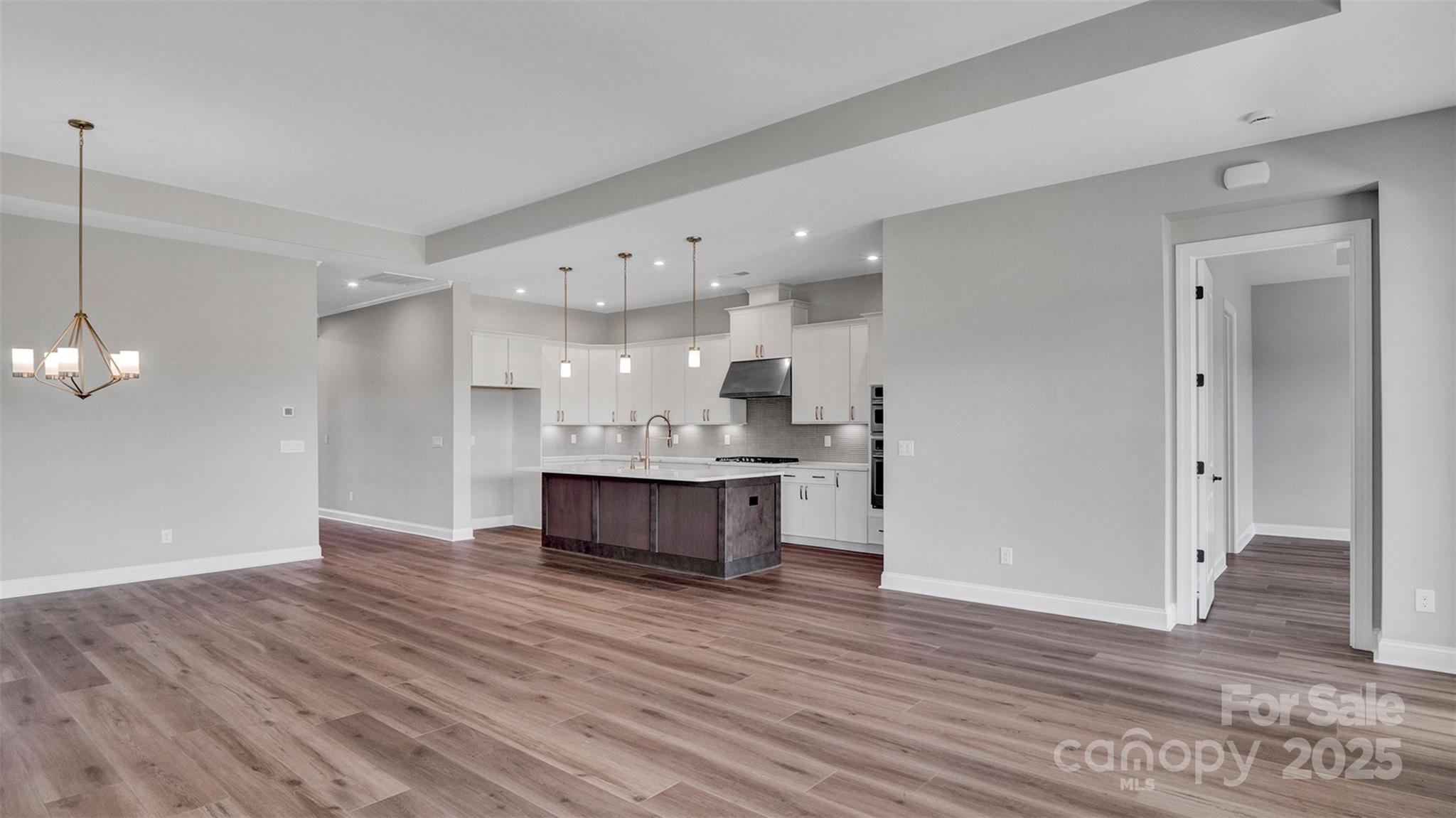 1031 Rabbit Hl Lane Monroe, NC 28110 - Photo 19 of 47 a view of kitchen with granite countertop cabinets and wooden floor