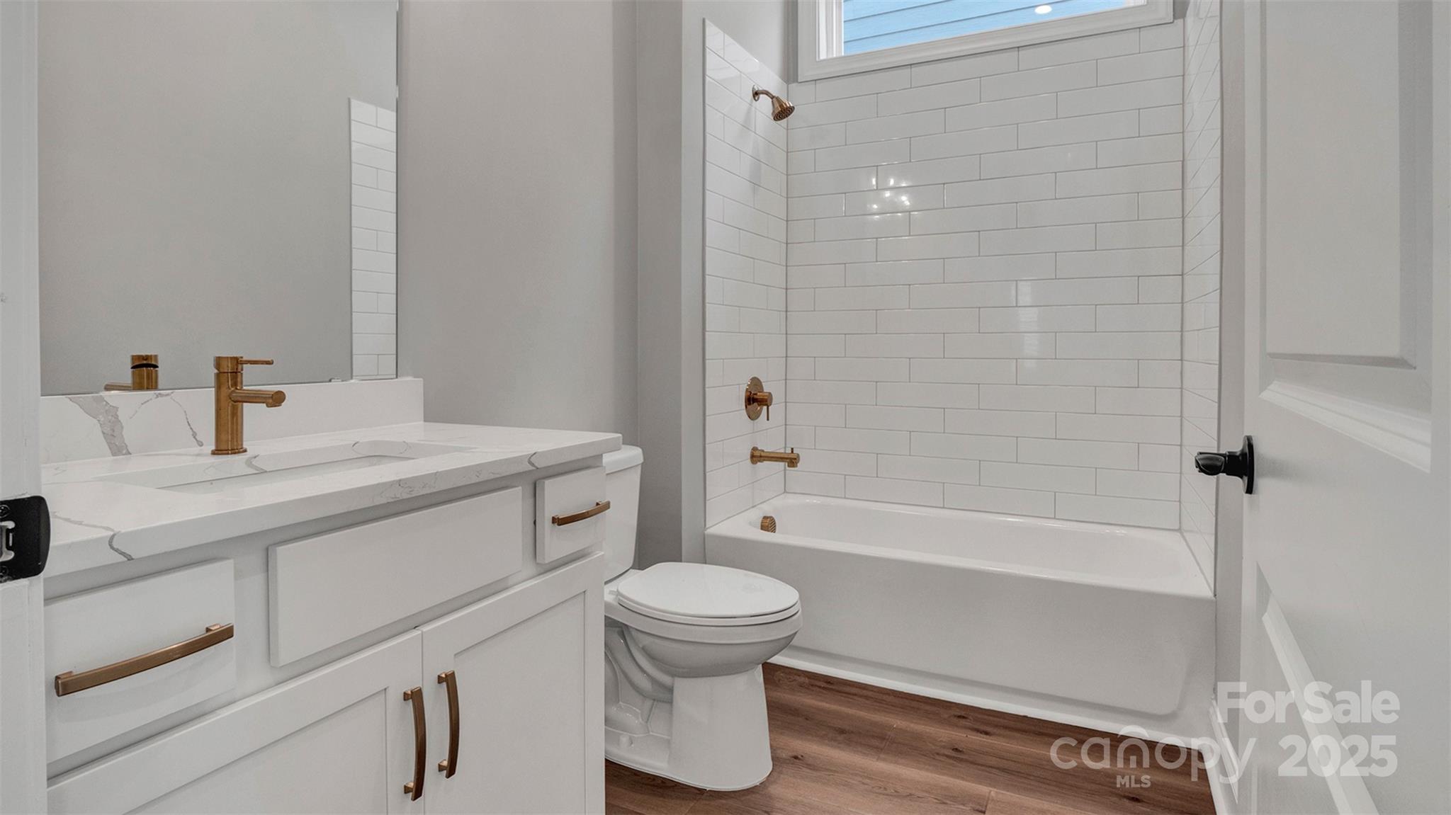 1031 Rabbit Hl Lane Monroe, NC 28110 - Photo 27 of 47 a bathroom with a sink a toilet and a bathtub