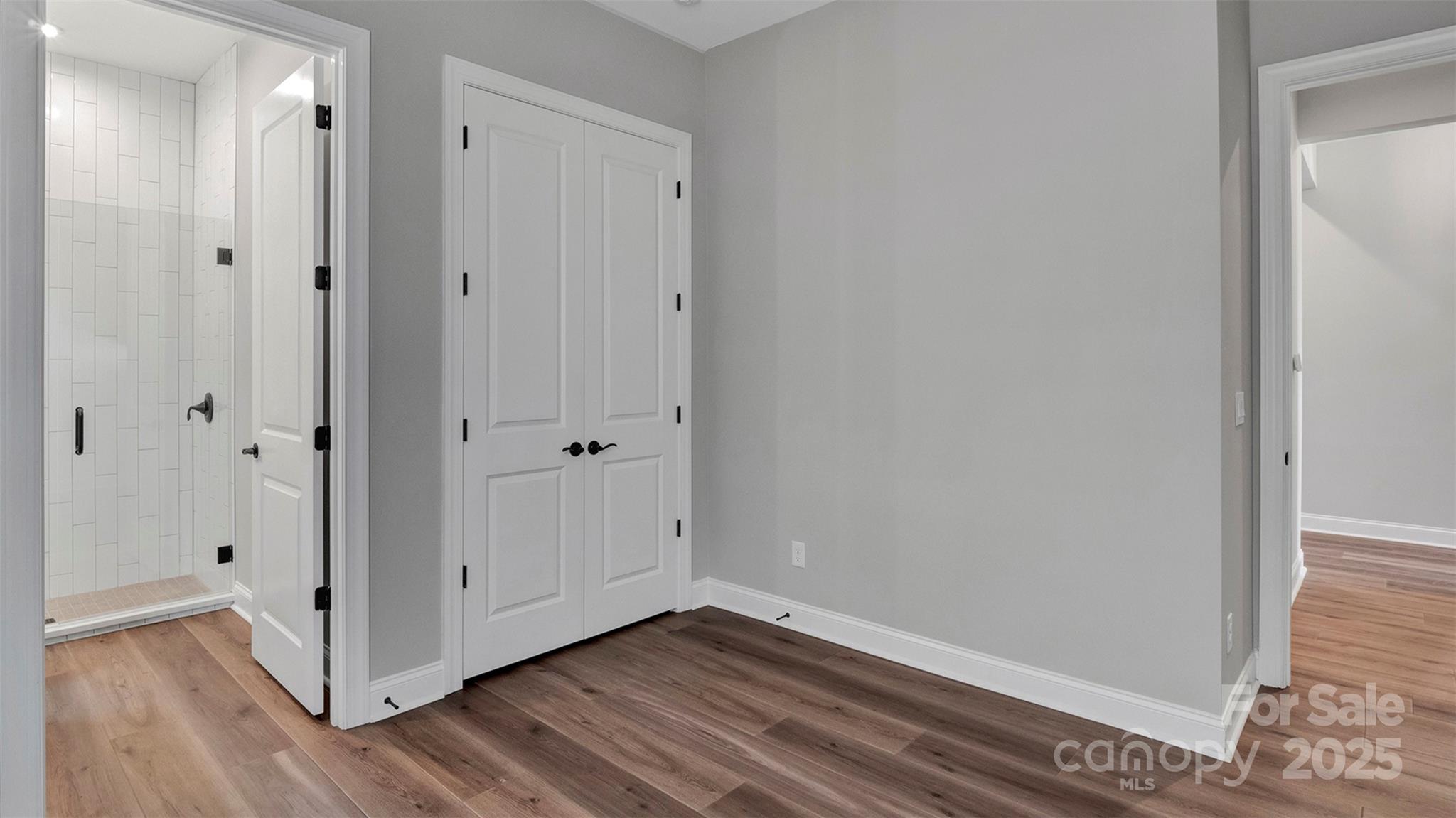 1031 Rabbit Hl Lane Monroe, NC 28110 - Photo 29 of 47 a view of an empty room with wooden floor