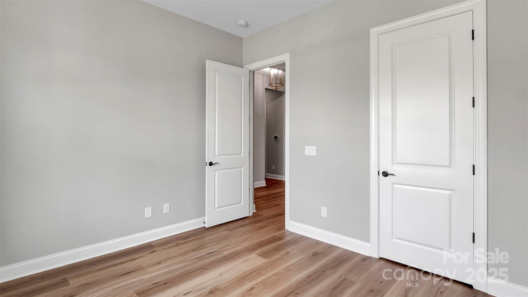 1031 Rabbit Hl Lane Monroe, NC 28110 - Photo 31 of 47 a view of an empty room with wooden floor