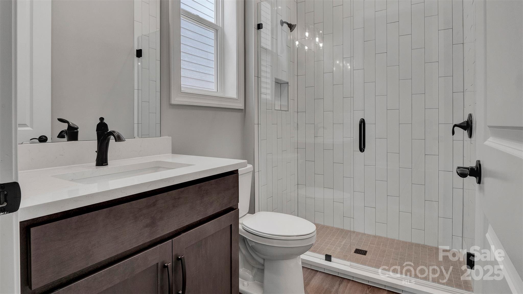 1031 Rabbit Hl Lane Monroe, NC 28110 - Photo 32 of 47 a bathroom with a sink a toilet and shower