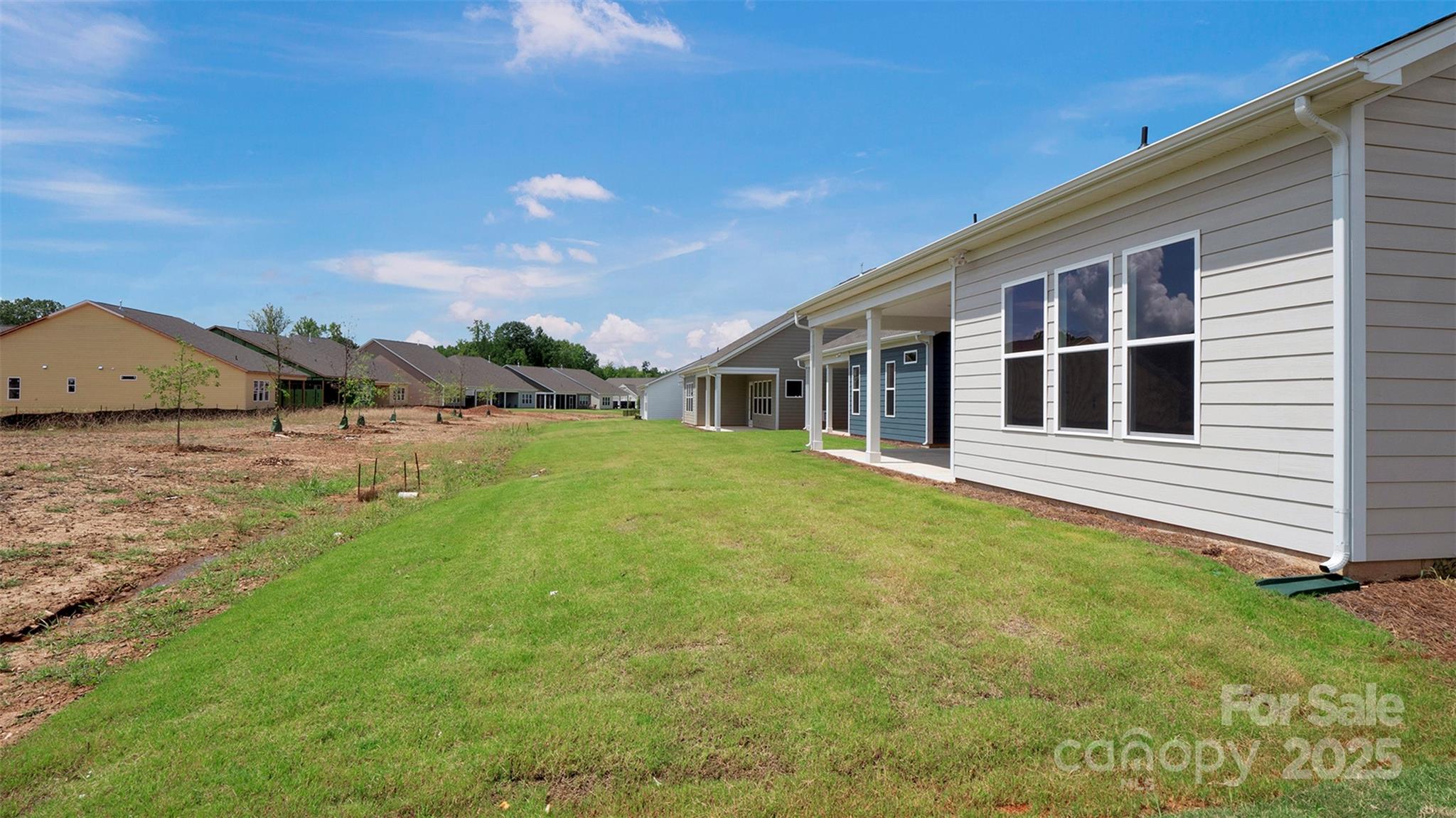 1031 Rabbit Hl Lane Monroe, NC 28110 - Photo 37 of 47 a house view with a garden space
