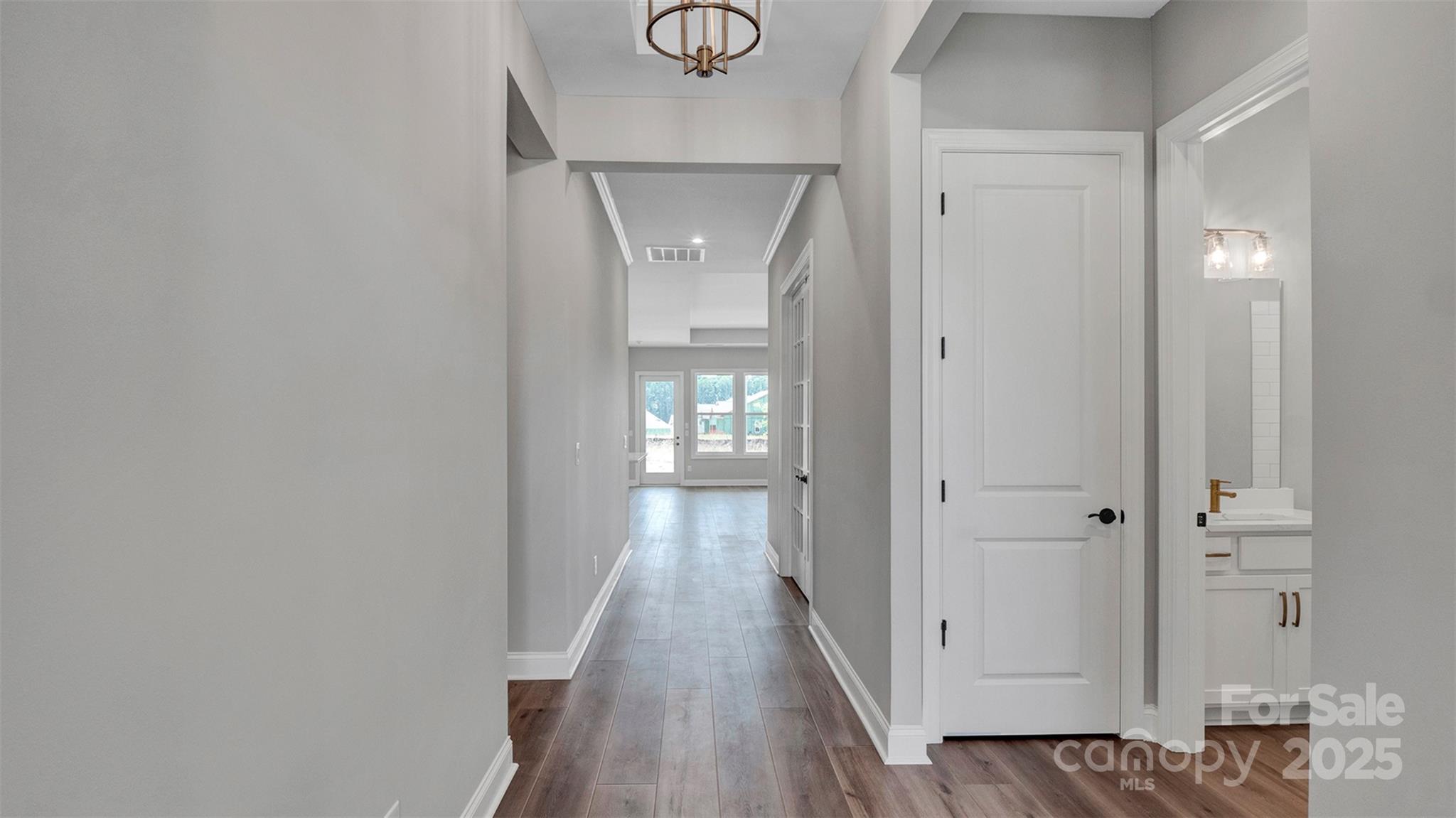 1031 Rabbit Hl Lane Monroe, NC 28110 - Photo 4 of 47 a view of a hallway with wooden floor