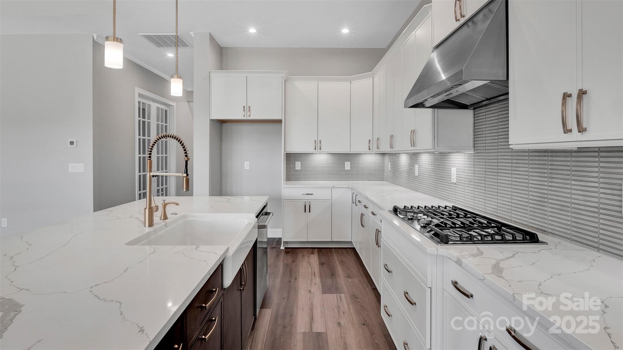 1031 Rabbit Hl Lane Monroe, NC 28110 - Photo 8 of 47 a kitchen with a sink stainless steel appliances and cabinets