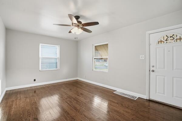 263 Taft Street Gary, IN 46404 - Photo 2 of 13 a view of empty room with wooden floor and fan