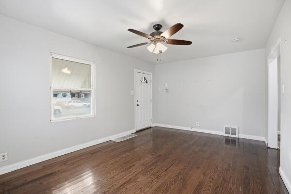 263 Taft Street Gary, IN 46404 - Photo 3 of 13 wooden floor in an empty room with a window