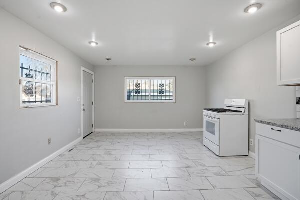 263 Taft Street Gary, IN 46404 - Photo 8 of 13 a view of a storage & utility room with a window