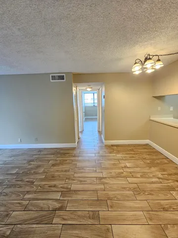 a view of a room with a flat screen tv