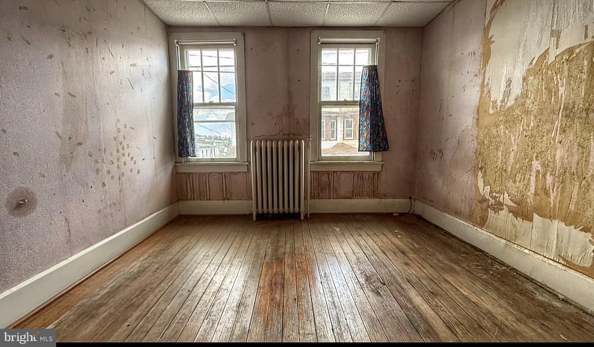 115 North Marshall Street Shamokin, PA 17872 - Photo 21 of 22 a view of an empty room with wooden floor and a window