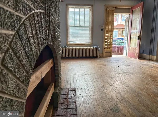 a view of an empty room with a balcony