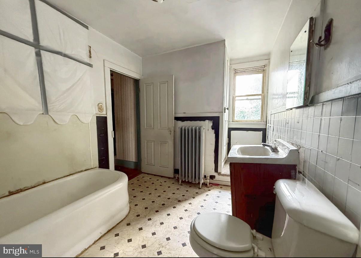 115 North Marshall Street Shamokin, PA 17872 - Photo 8 of 22 a bathroom with a sink toilet and shower