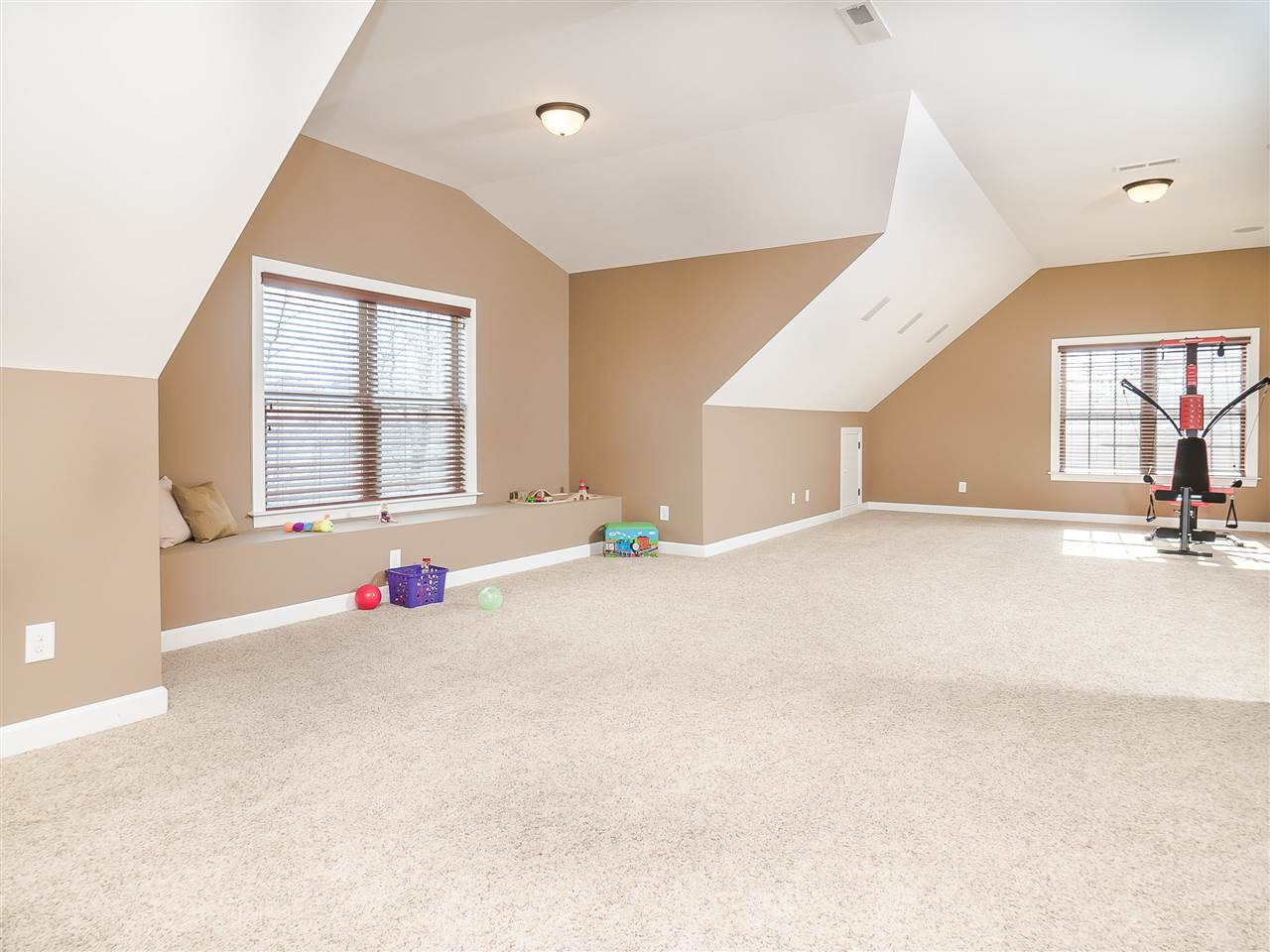 3004 Royal Forrest Drive Raleigh, NC 27614 - Photo 19 of 25 This bonus room is massive!!! It can be easily divided into different areas for everyone to enjoy. Located on the third floor, there is a large window seat, attic storage space and a private full bathroom. Movie nights and popcorn for everyone! Bonus Room