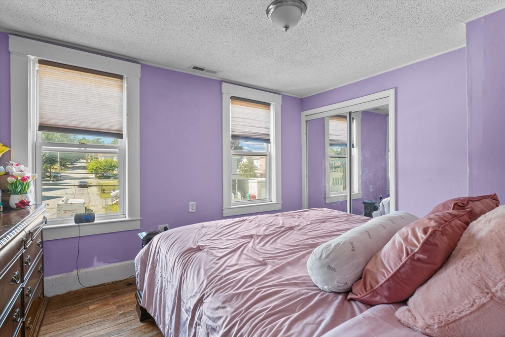 81 5th Avenue Lowell, MA 01854 - Photo 15 of 35 a bedroom with a bed and a window