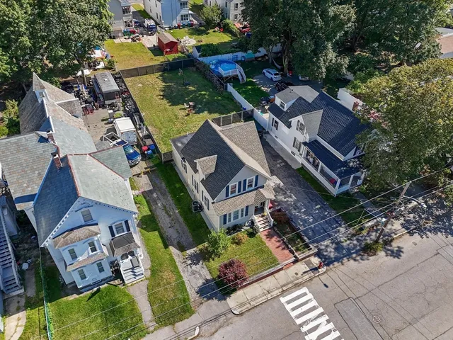an aerial view of a house with a garden