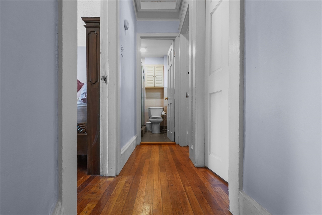 81 5th Avenue Lowell, MA 01854 - Photo 7 of 35 a view of a hallway with wooden floor