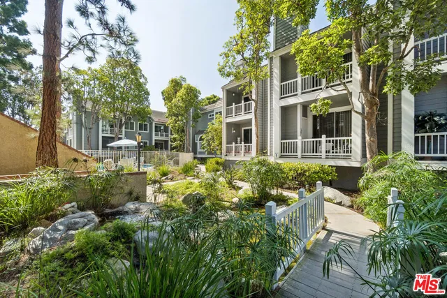 a view of a house with a flower garden