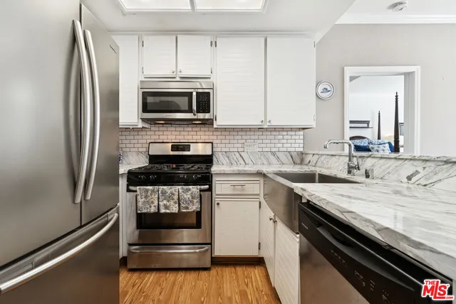a kitchen with a stove and a microwave