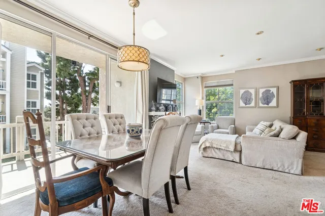 a view of a dining room with furniture window and outside view