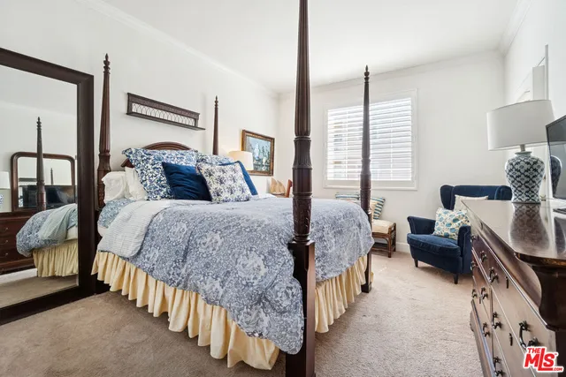 a bed room with a bed and a couch