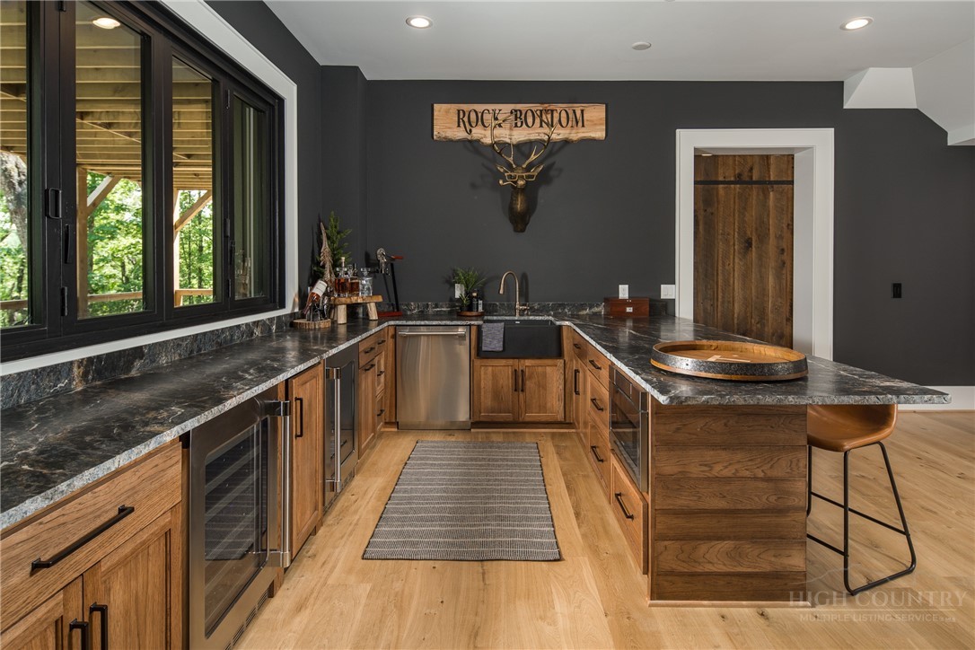 1236 Ninebark Road Boone, NC 28607 - Photo 30 of 50 a kitchen with a sink and large windows