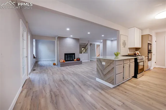 a view of kitchen with granite countertop lots of counter top space