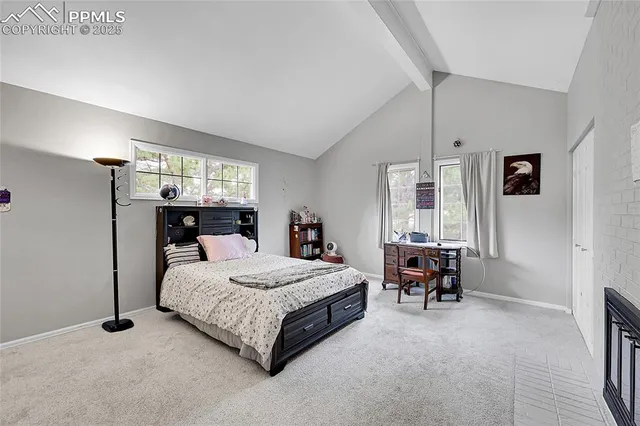 a bedroom with a bed and a table in it