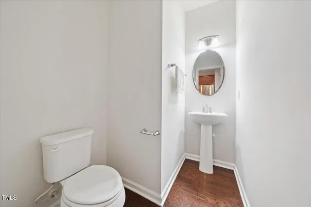 a bathroom with a toilet and a sink