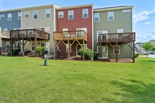 a view of a house next to a yard