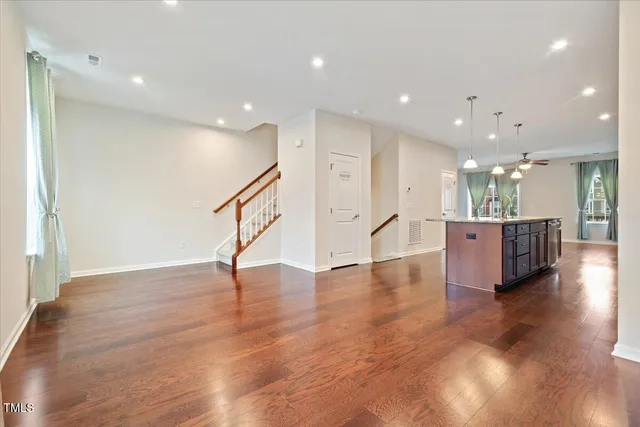 a view of a kitchen with a sink and a living room