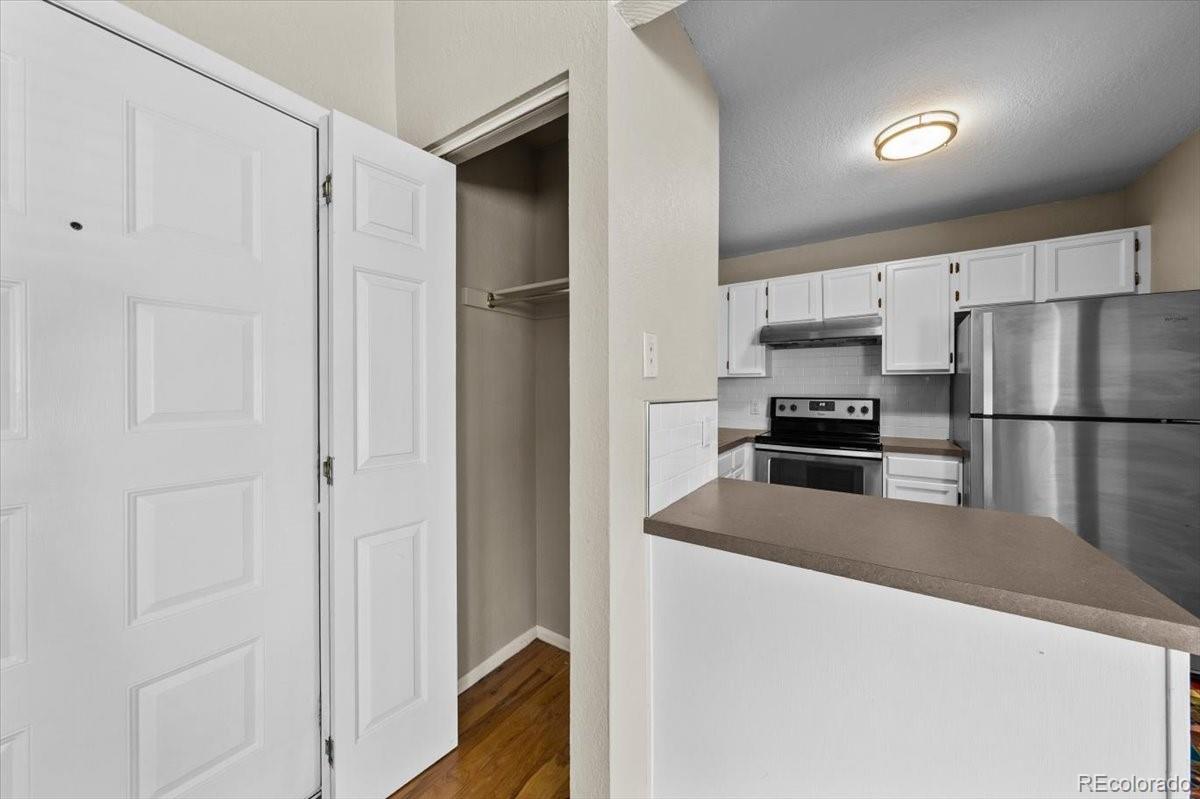 3545 28th Street, Unit 304 Boulder, CO 80301 - Photo 9 of 23 a kitchen with stainless steel appliances a refrigerator and a stove top oven