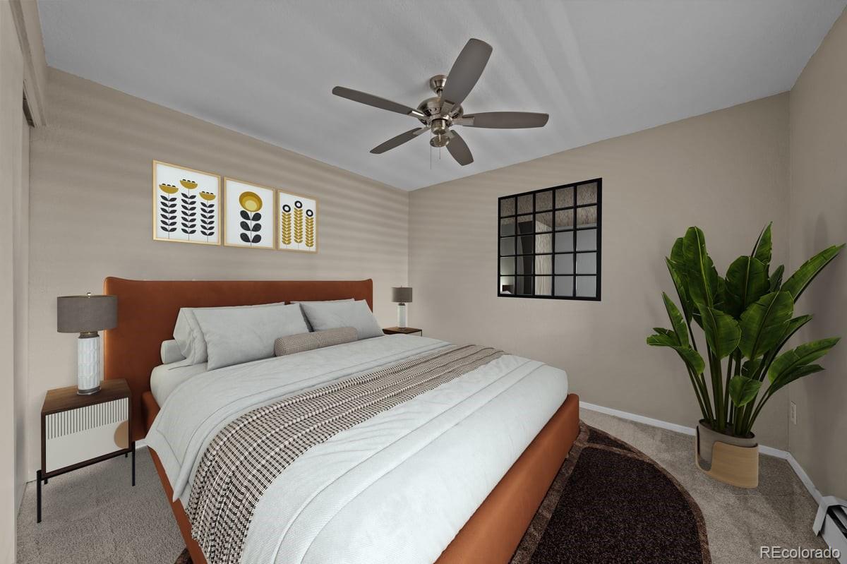 3545 28th Street, Unit 304 Boulder, CO 80301 - Photo 10 of 23 a bedroom with a large bed and a potted plant