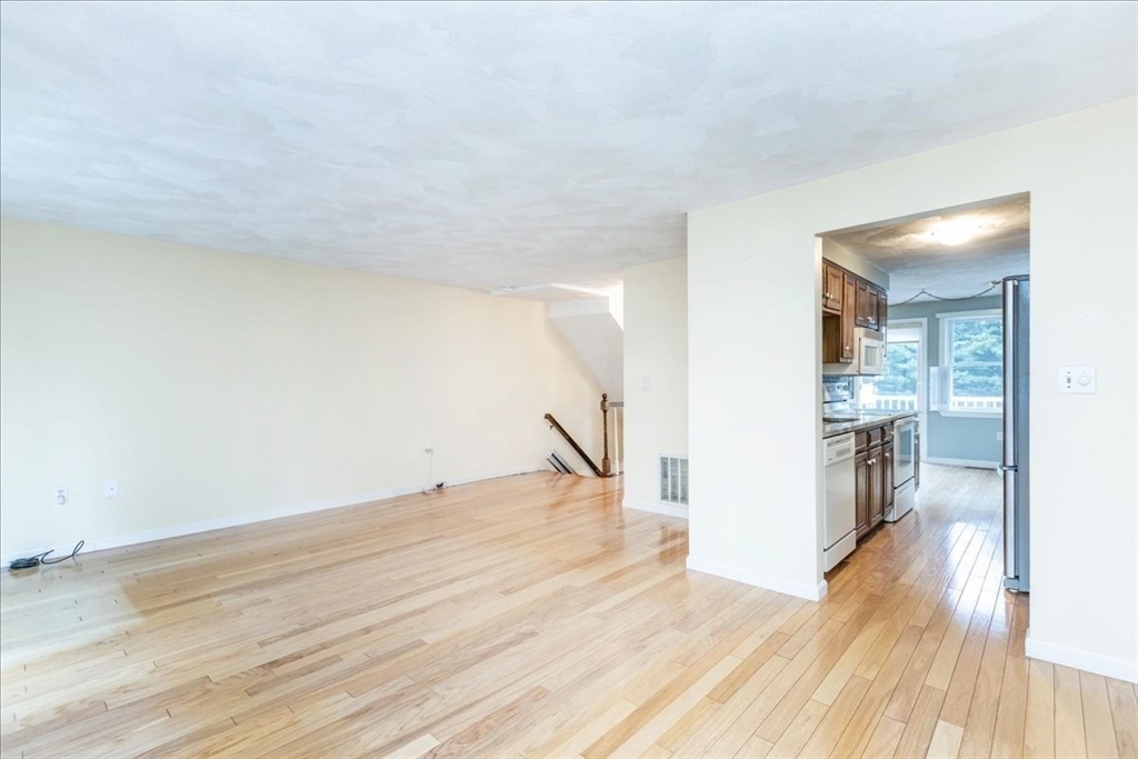 22 Collins Street, Unit 46 Danvers, MA 01923 - Photo 12 of 37 a view of a kitchen with wooden floor and a kitchen