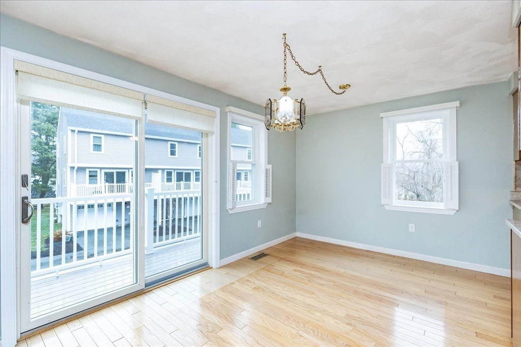22 Collins Street, Unit 46 Danvers, MA 01923 - Photo 19 of 37 a view of a livingroom with wooden floor and windows