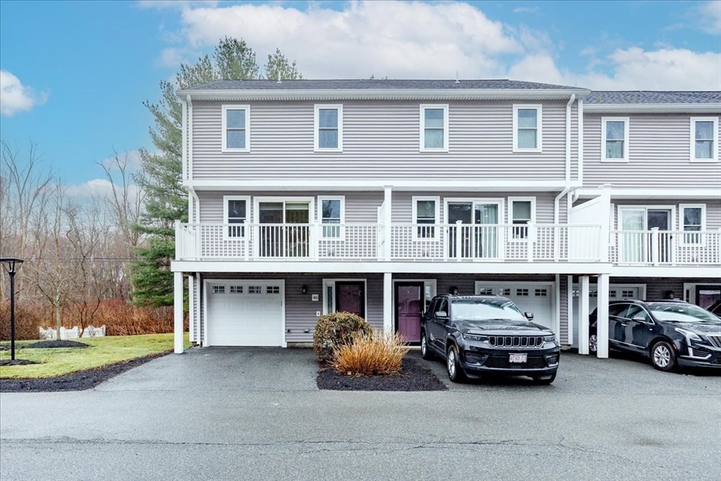22 Collins Street, Unit 46 Danvers, MA 01923 - Photo 2 of 37 a car parked in front of a building