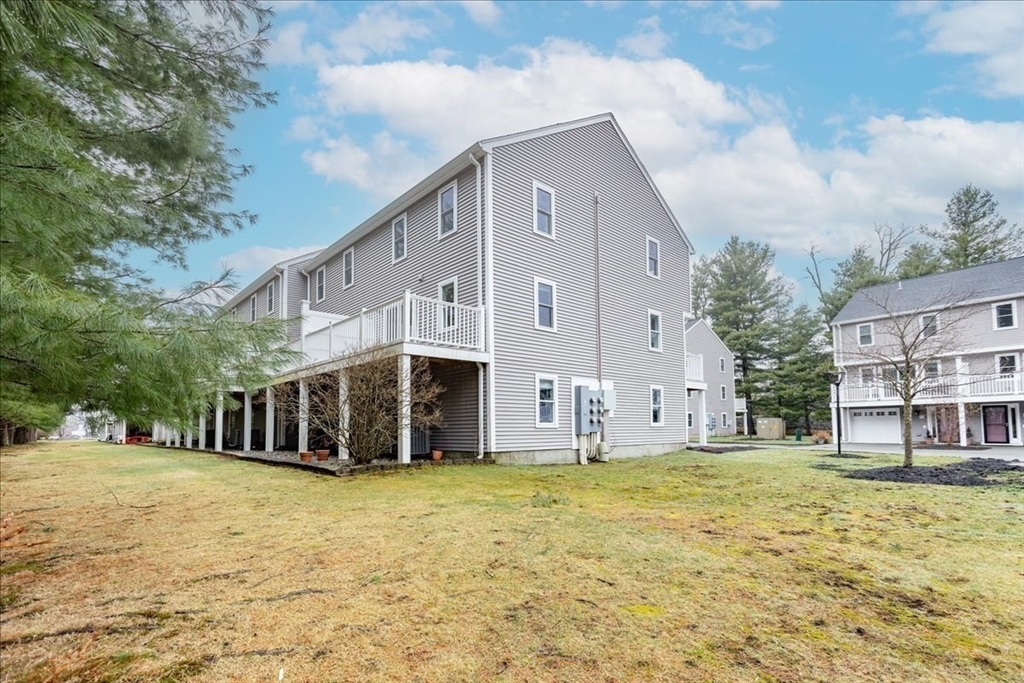 22 Collins Street, Unit 46 Danvers, MA 01923 - Photo 3 of 37 a view of a house with backyard and trees